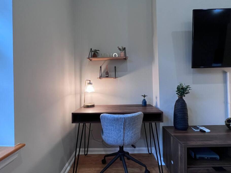 a desk with a chair and a lamp in a room at Beautiful 1BD With Balcony Hosted By StayRafa - 2F in Philadelphia