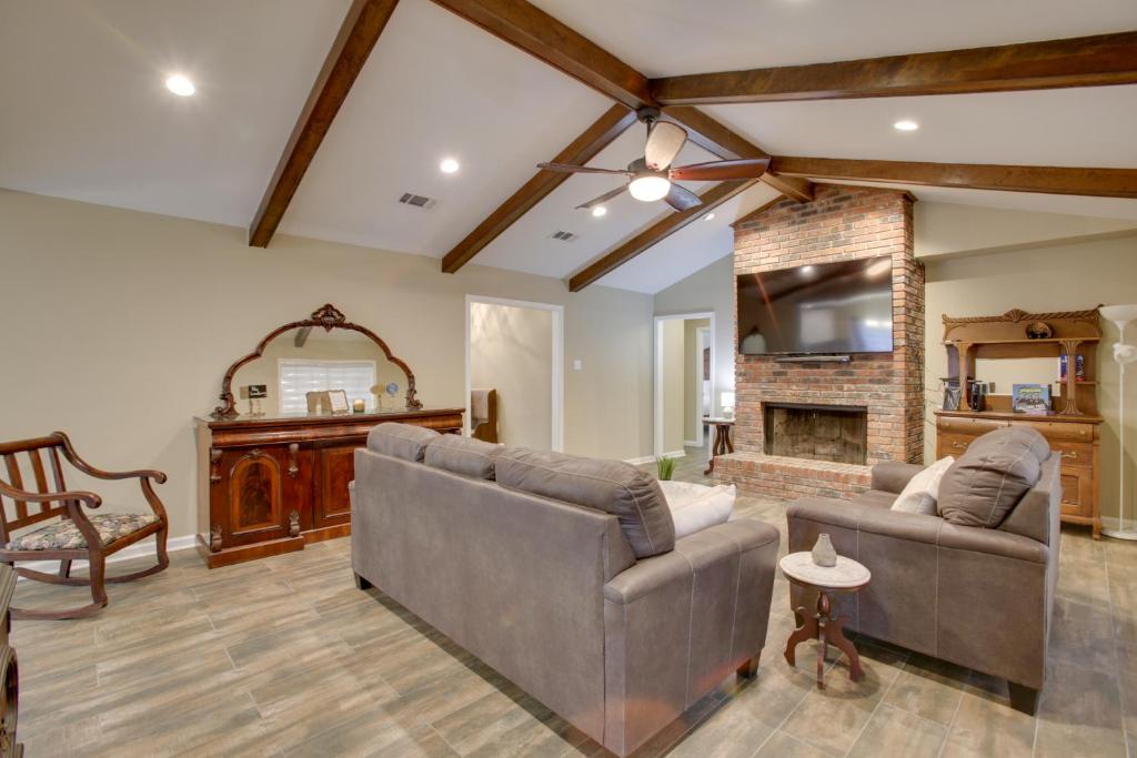 a living room with two couches and a fireplace at Spacious Baton Rouge Home Rental 12 Mi to LSU! in Baton Rouge