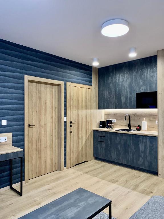 Kuchyň nebo kuchyňský kout v ubytování REMAR - Apartamenty z widokiem na Jezioro Biale