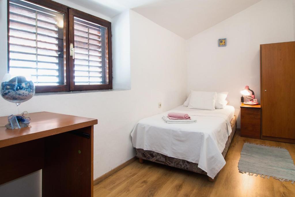 Postel nebo postele na pokoji v ubytování Split Accommodation