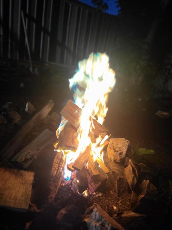 a fire pit in a yard at night at Makins trap 