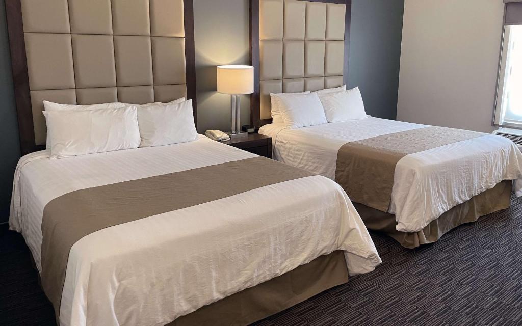 Postel nebo postele na pokoji v ubytování Best Western Plus Chihuahua Juventud