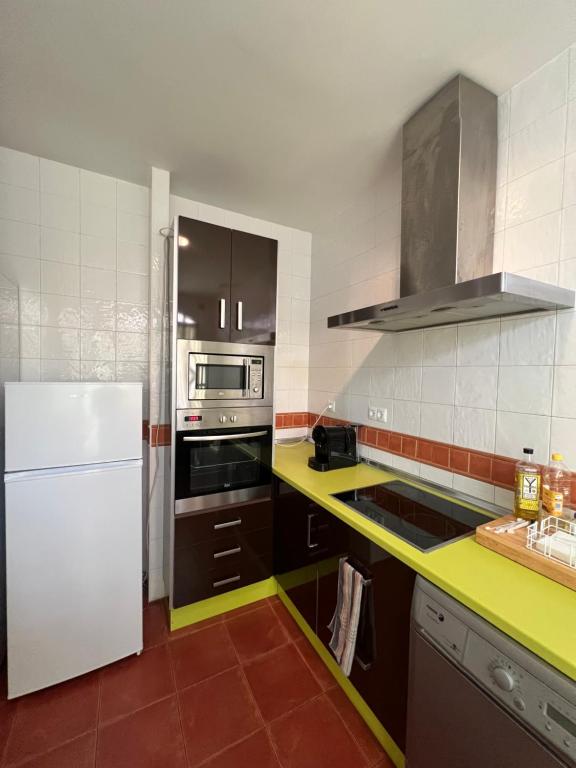 Kuchyň nebo kuchyňský kout v ubytování Apartamentos Sevilla Deluxe Rosales