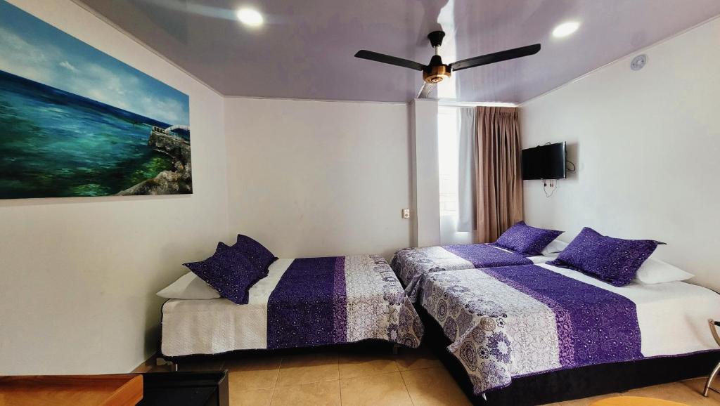Postel nebo postele na pokoji v ubytování Hotel Olas