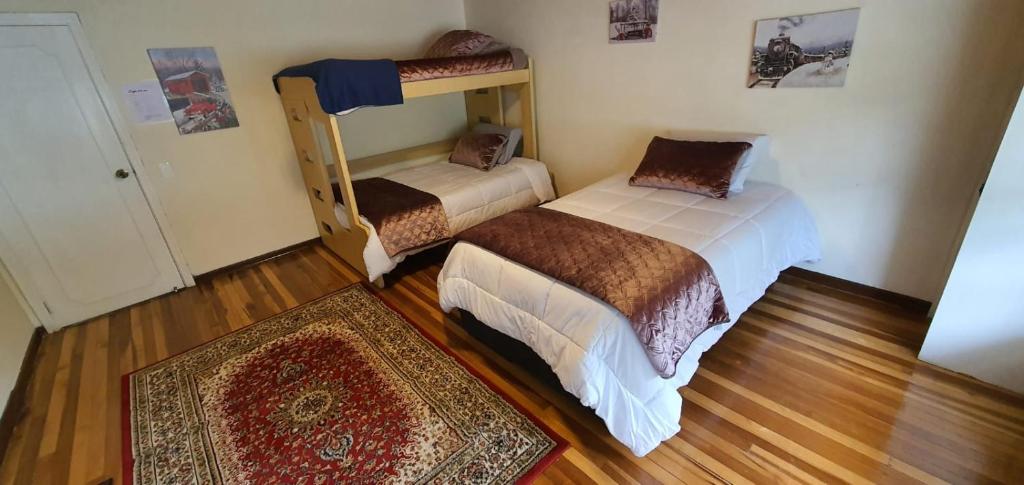 Voodi või voodid majutusasutuse Casa Hostal Sweet Home toas