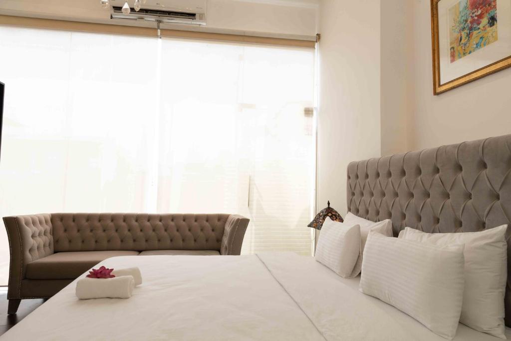 Postel nebo postele na pokoji v ubytování Lotus Colombo Guesthouse