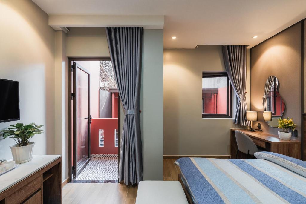 Giường trong phòng chung tại Thảo Nguyên House