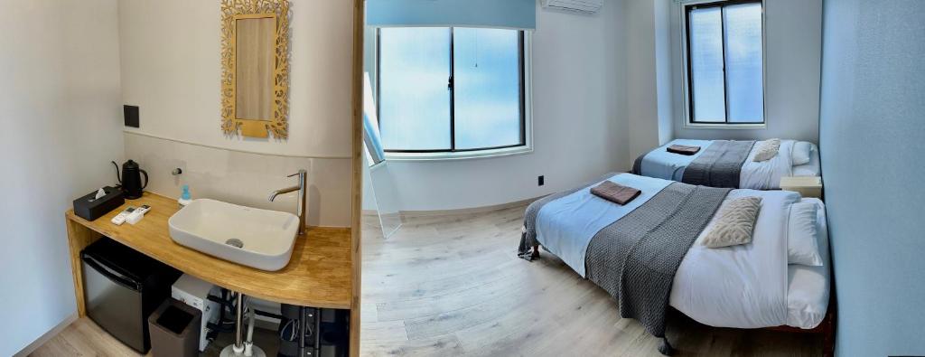 Postel nebo postele na pokoji v ubytování CABIN Nozawaonsen