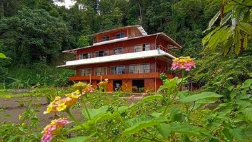 a large wooden house in the middle of a forest at VILLA ENCANTO in El Valle