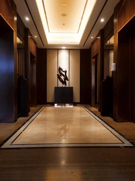 a dance floor in a room with a stage at DeAr Caspian Grand Sunkono Lagoon Apartment in Surabaya