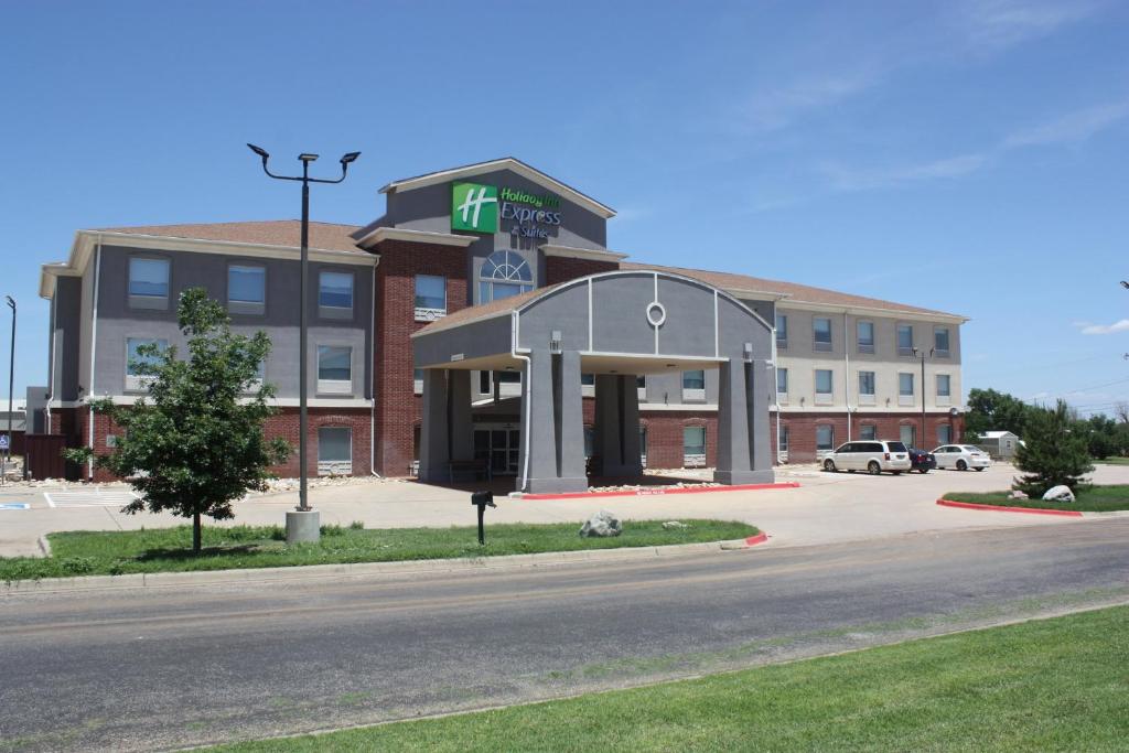 a building with a clock on it on a street at Holiday Inn Express Hotel & Suites Shamrock North, an IHG Hotel in Shamrock