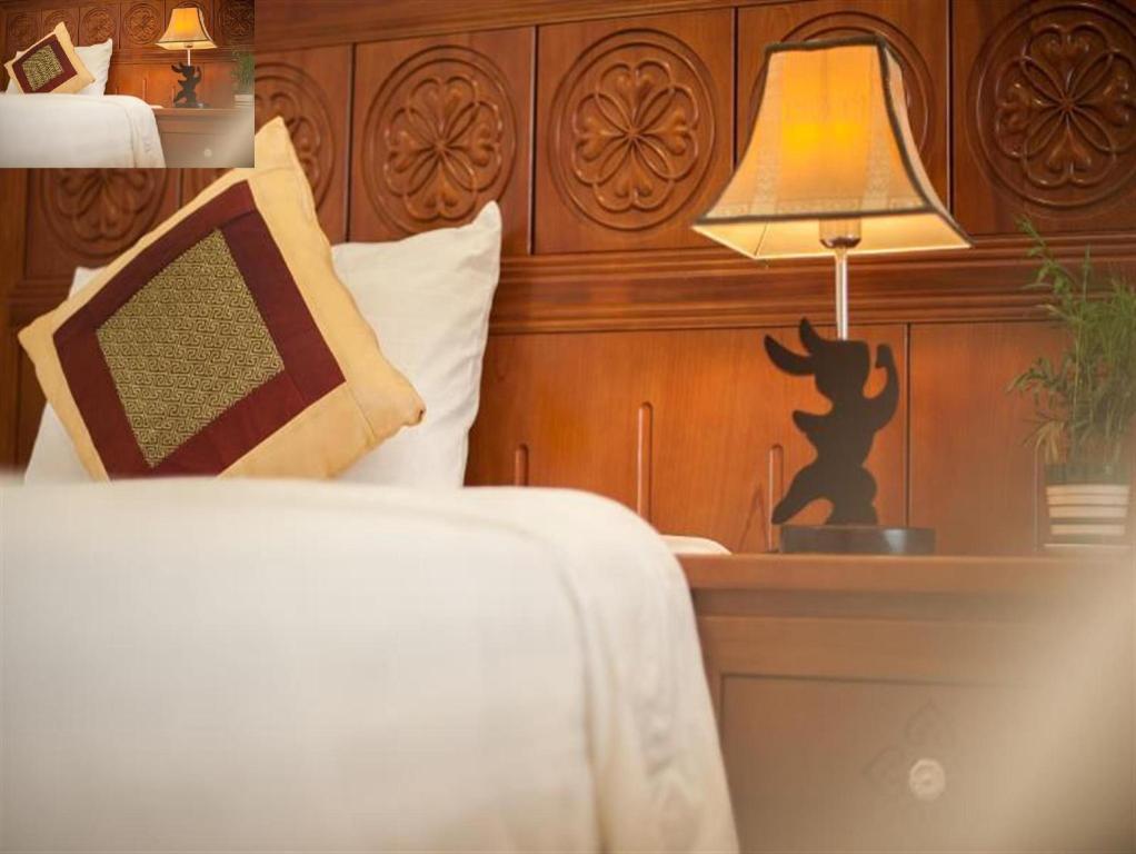 Postel nebo postele na pokoji v ubytování Lefoyer Hotel