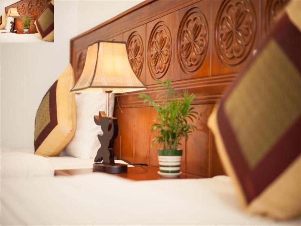 Postel nebo postele na pokoji v ubytování Lefoyer Hotel