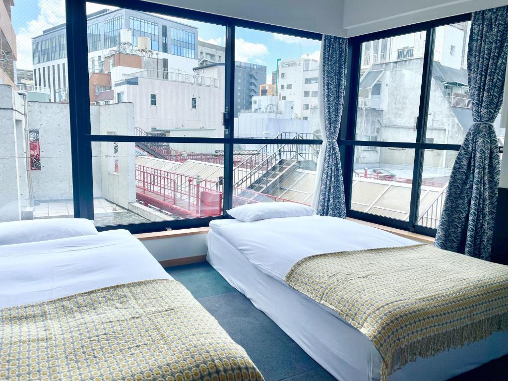Postel nebo postele na pokoji v ubytování Asakusa Kokono Club Hotel