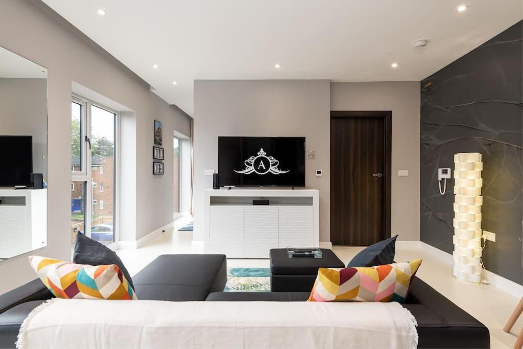 a living room with a couch and a tv at Summer work base Isle of Grain contractors - Apartment 7 in Gillingham