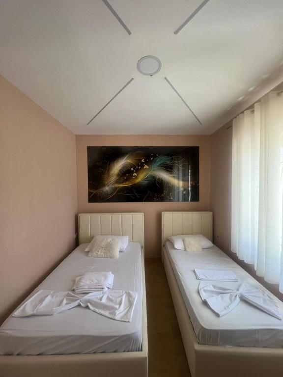 Postel nebo postele na pokoji v ubytování MIQT GUEST HOUSE