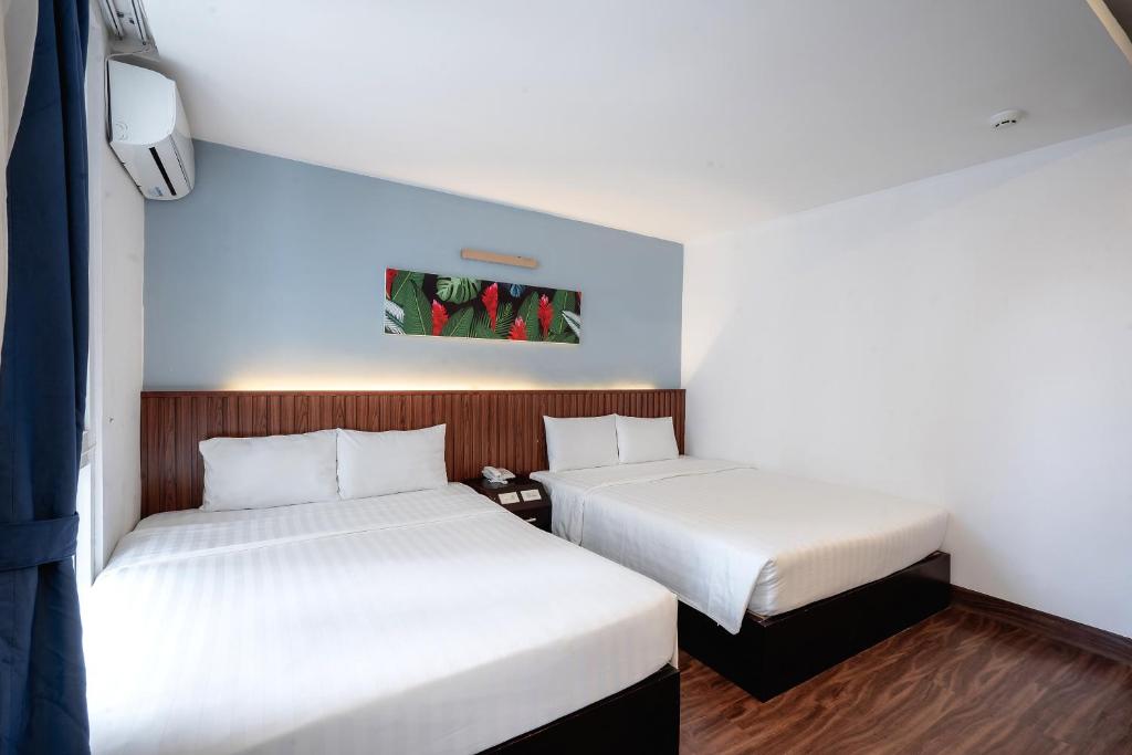 Giường trong phòng chung tại King Hotel