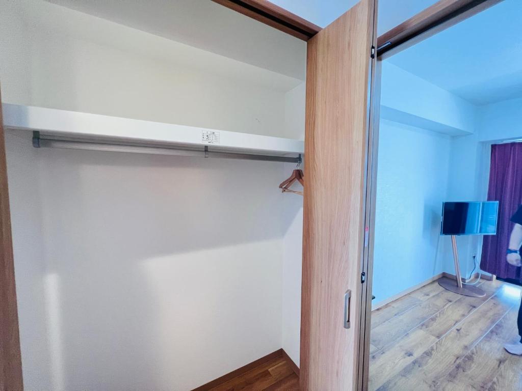 Postel nebo postele na pokoji v ubytování 吉豊ホテル