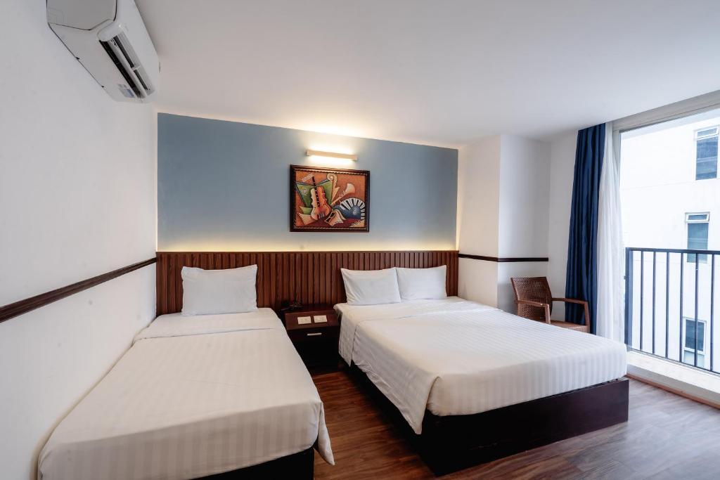 Giường trong phòng chung tại King Hotel