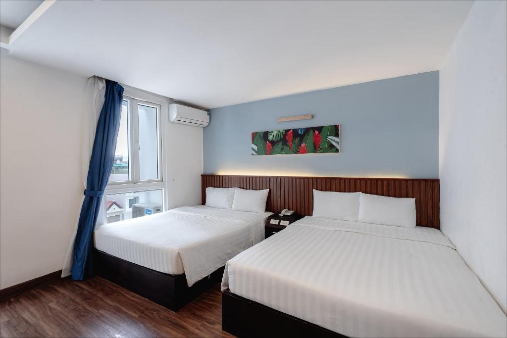 Giường trong phòng chung tại King Hotel