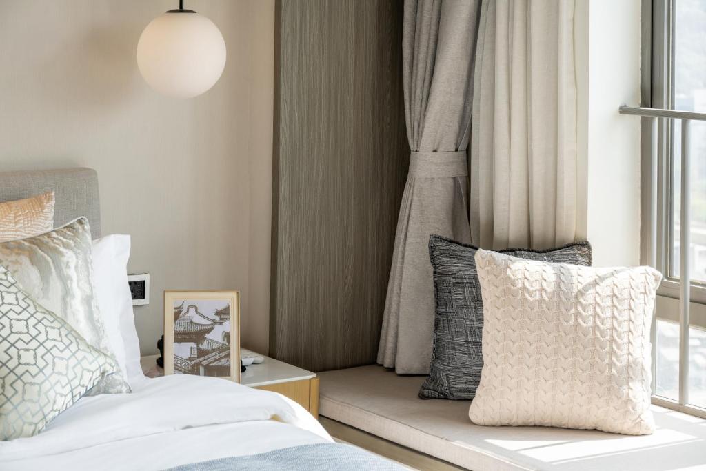 Postel nebo postele na pokoji v ubytování Keypai Hotel
