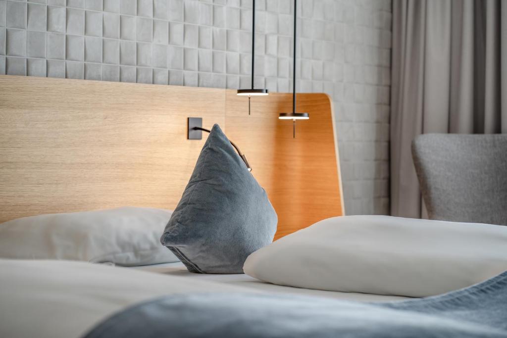 Postel nebo postele na pokoji v ubytování Novotel Karlsruhe City