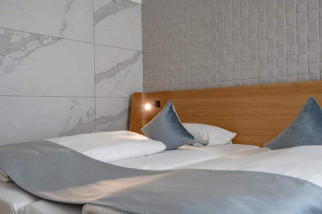 Postel nebo postele na pokoji v ubytování Novotel Karlsruhe City
