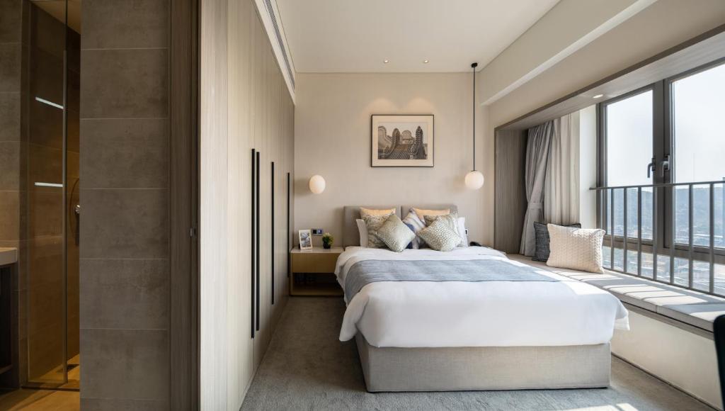 Postel nebo postele na pokoji v ubytování Keypai Hotel