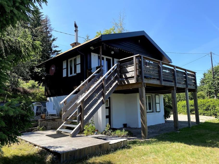 a house with a staircase leading up to it at Le chalet des coeurs in Le Tholy