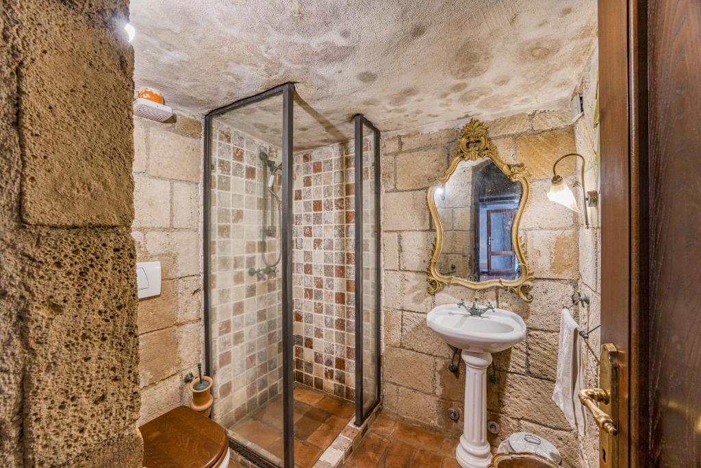 A bathroom at Torre Del Melograno With Heated Pool - Happy Rentals