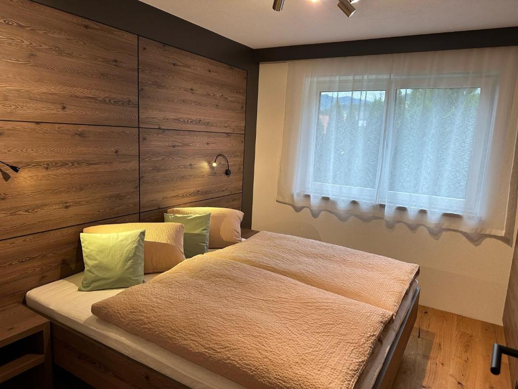 a bedroom with a large bed and a window at Apart Finazzer in Wenns