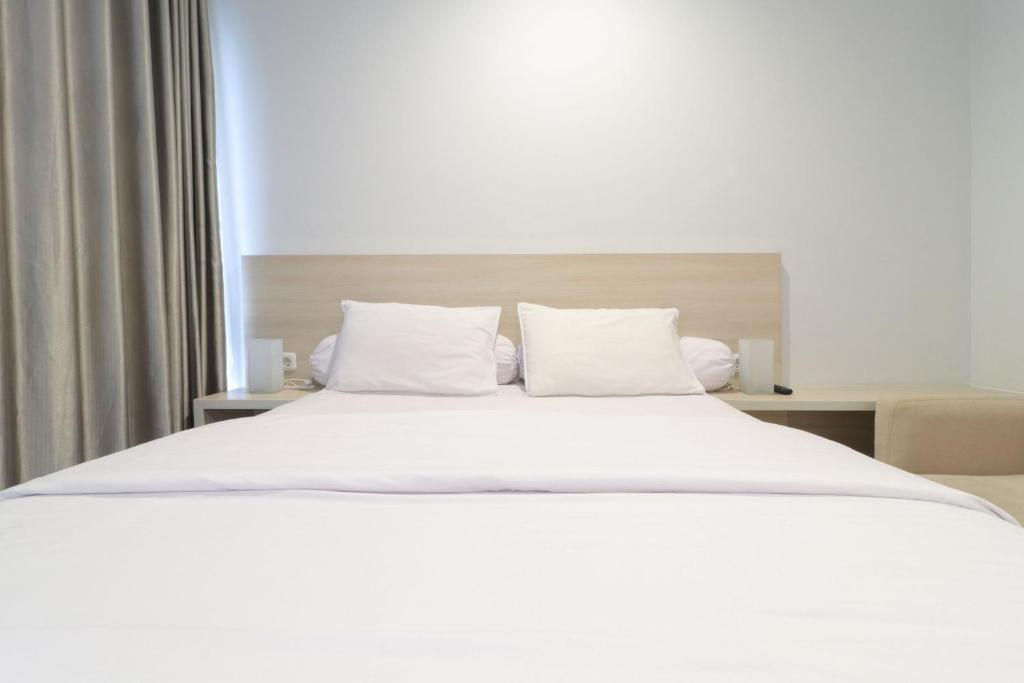 Postel nebo postele na pokoji v ubytování Mendjangan Residence