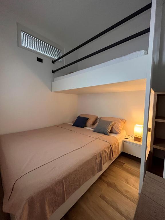 Postel nebo postele na pokoji v ubytování APARTMA NIKA
