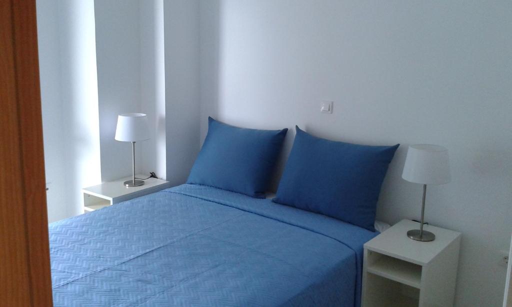 Postel nebo postele na pokoji v ubytování Aetofolia Stella Villas