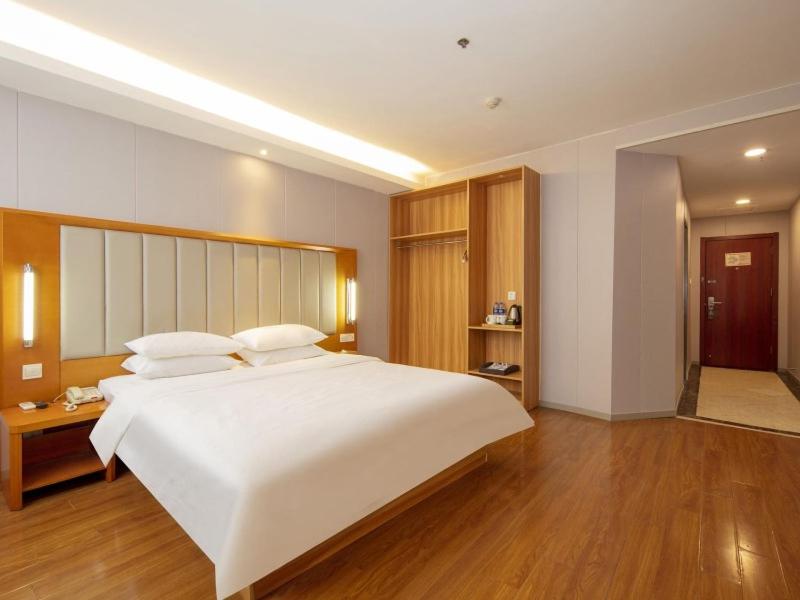Krevet ili kreveti u jedinici u objektu GreenTree Alliance Jiangsu Huai'an Suning Plaza
