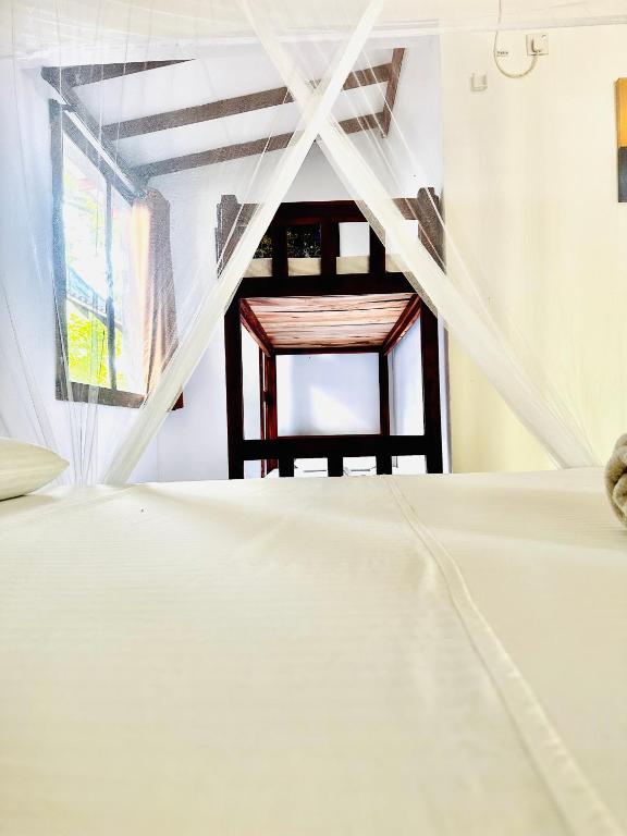 Postel nebo postele na pokoji v ubytování Riva del Sole Guest House