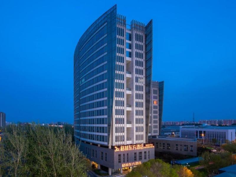 una representación de un edificio alto en una ciudad en GreenTree Eastern Hotel Tianjin Wuqing Wanda Plaza, en Wuqing