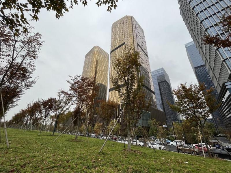 a park in a city with tall buildings at GreenTree Eastern Hotel Yiwu International Trade City in Yiwu
