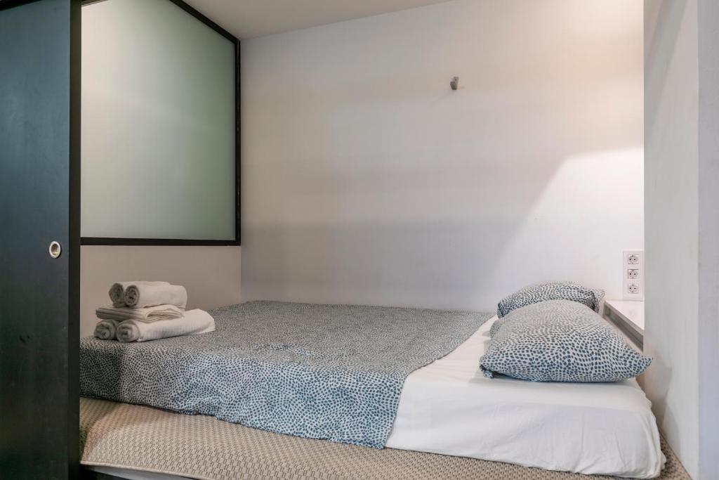 Postel nebo postele na pokoji v ubytování HOMEABOUT MADRID RÍO APARTMENT