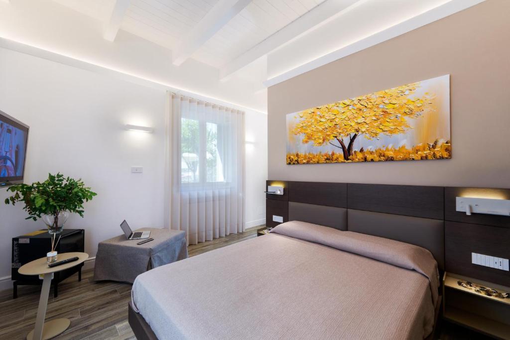 Postel nebo postele na pokoji v ubytování AGAVE B&B