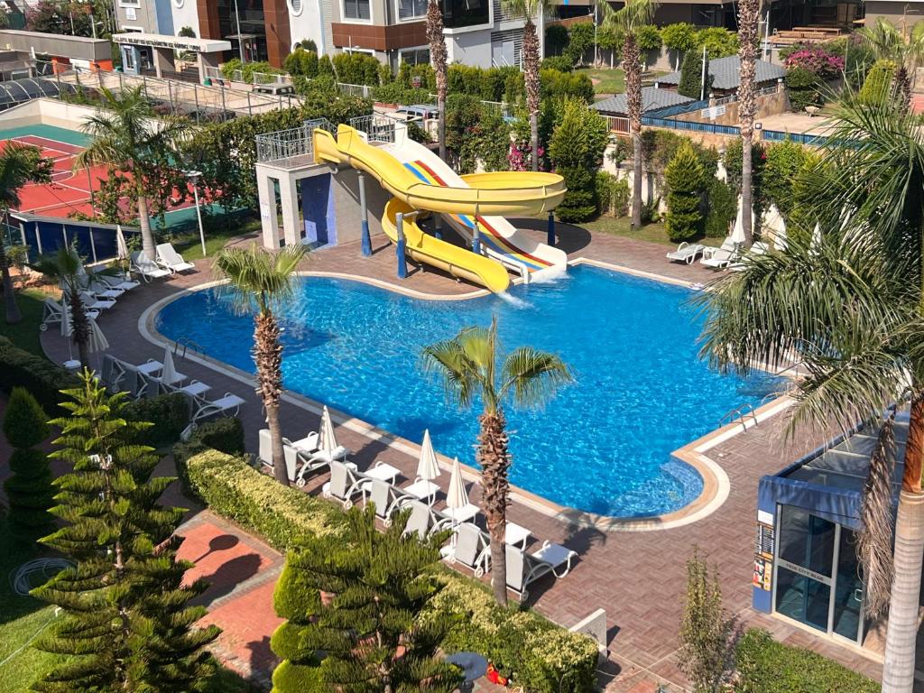 an overhead view of a swimming pool with a slide at Penthouse 4 bedrooms, 1 living room, to the sea 7 minutes walk in Alanya