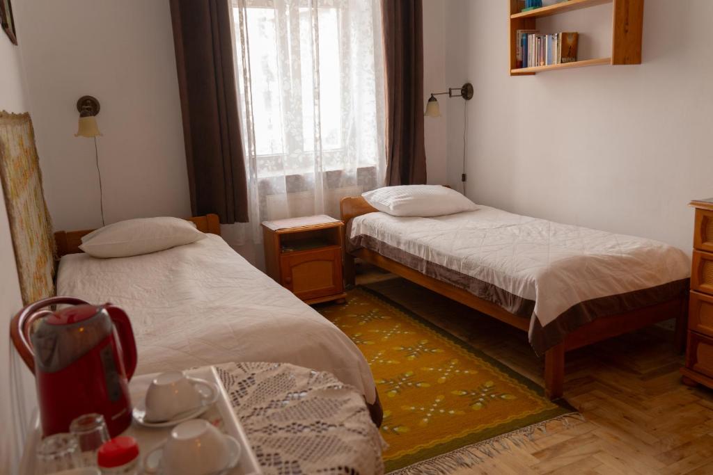 Postel nebo postele na pokoji v ubytování Kolory Guest House