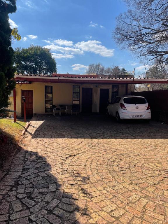 a car parked in front of a house at Crystal Mini Pozz Palace in Johannesburg