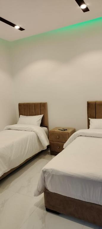 Postel nebo postele na pokoji v ubytování Mussa Spring Hotel