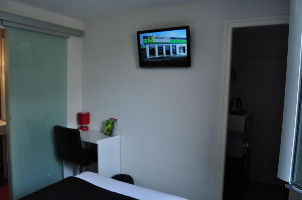 TV o dispositivi per l'intrattenimento presso Hôtel Le Loft