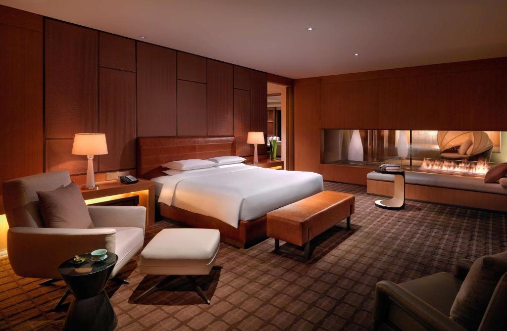 Postel nebo postele na pokoji v ubytování Hyatt Regency Tianjin East