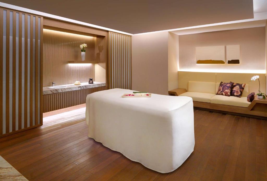 Postel nebo postele na pokoji v ubytování Hyatt Regency Tianjin East