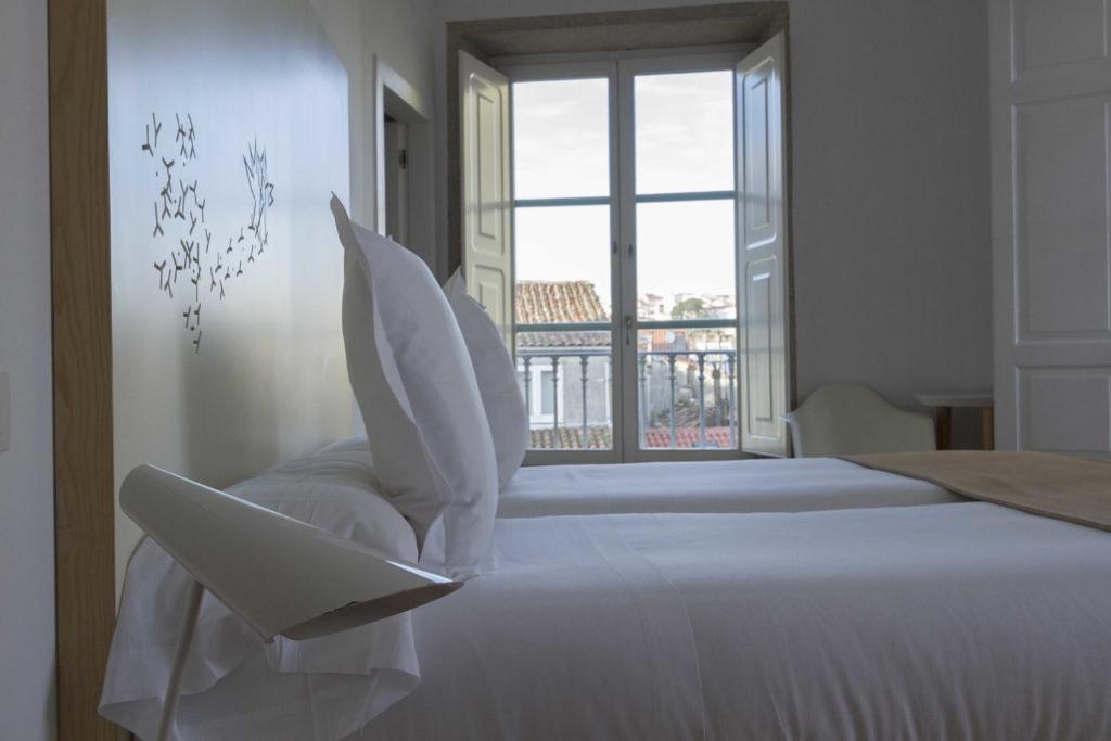 Postel nebo postele na pokoji v ubytování Hotel Pazo de Altamira