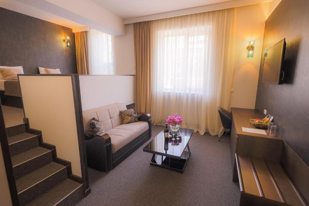 Posezení v ubytování Cascade Hotel