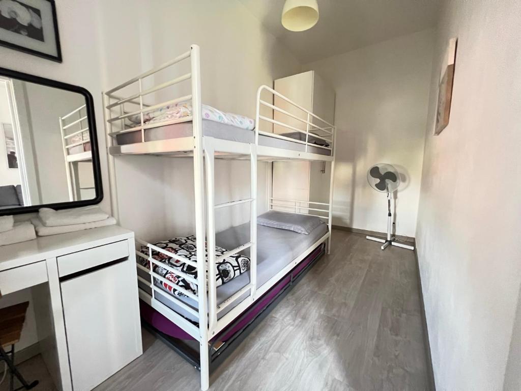 A bed or beds in a room at Celia's Home - Expo Fiera Milano